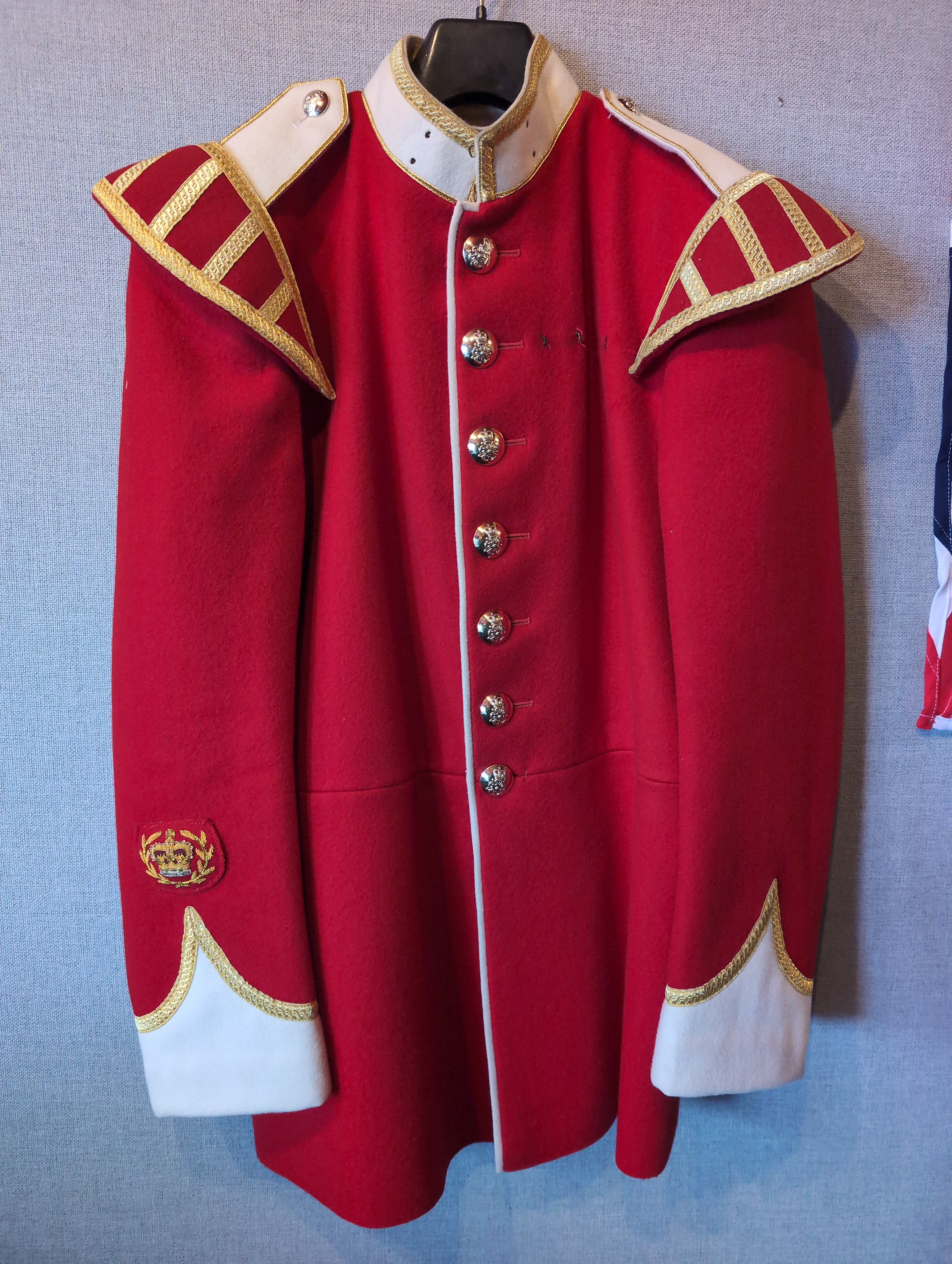 A King's Division bandsman's ceremonial tunic. Scarlet Melton wool with white facings and white piping, WO2 rank, bandsman's insignia. our ref G83