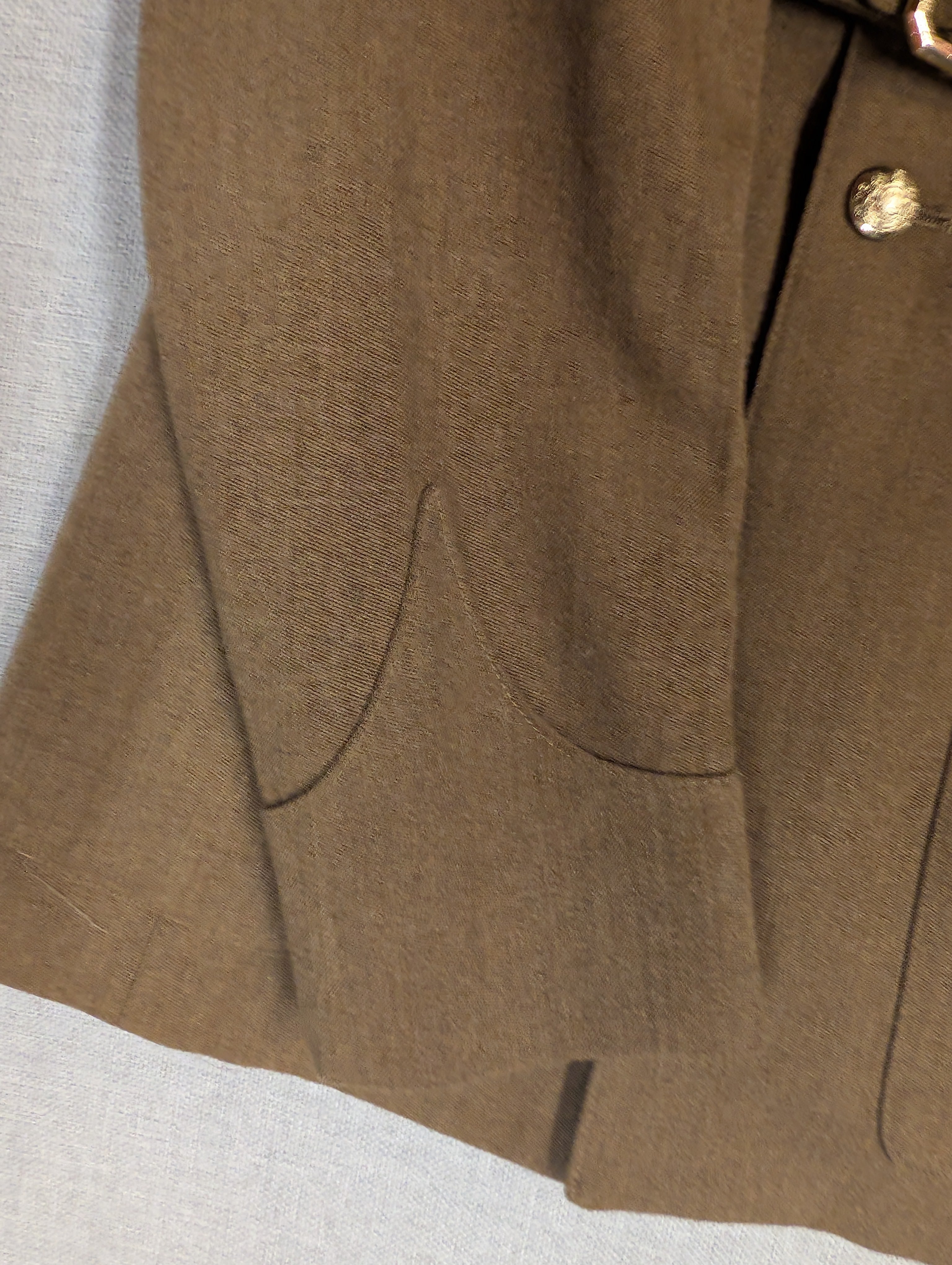Close up of V style Cuff on a British Army No.2 Uniform Jacket & Goodwood Revival Colour Sergeant Rank on arm with Royal Artillery Collar Badges