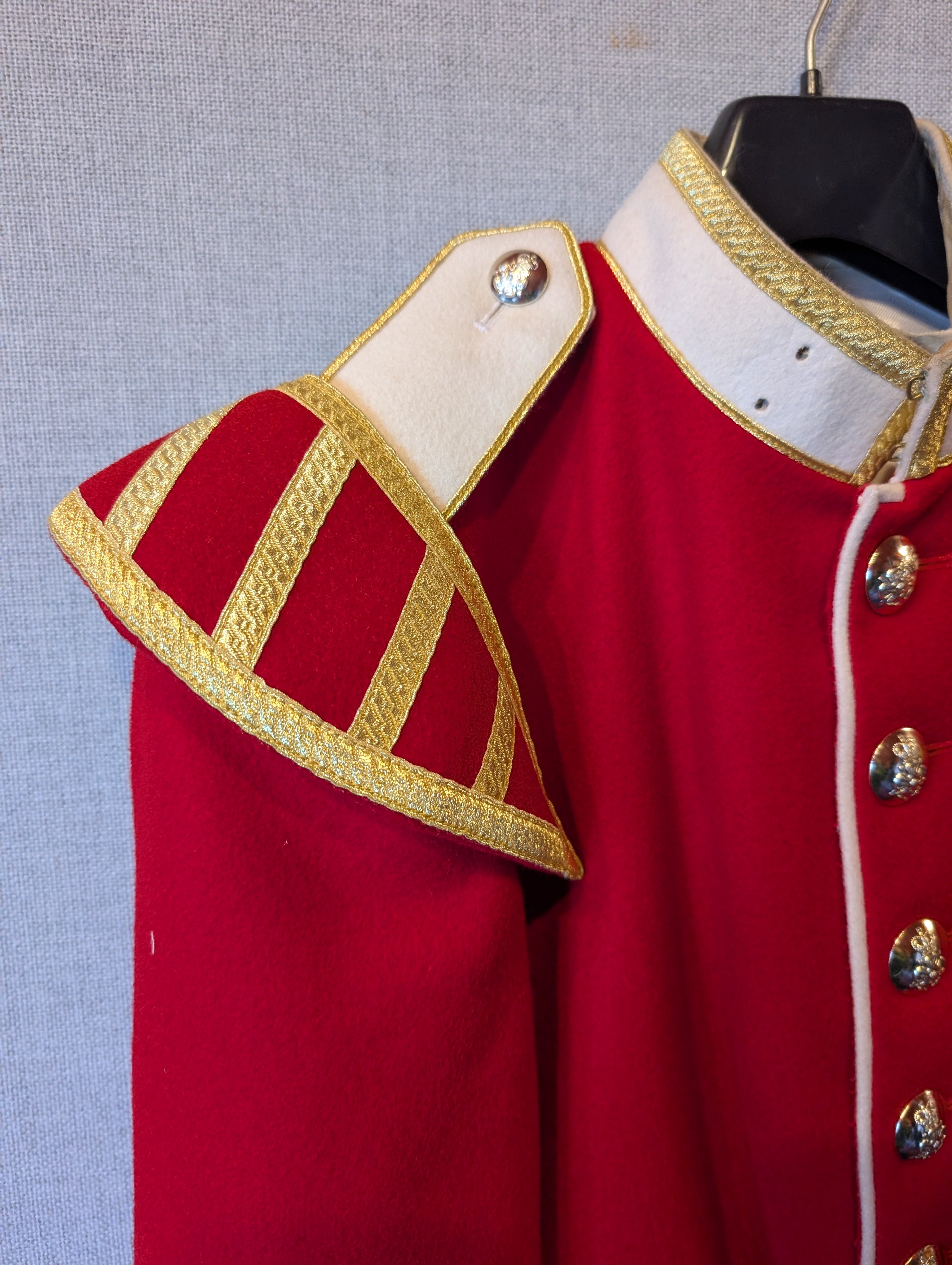 A King's Division bandsman's ceremonial tunic. Scarlet Melton wool with white facings and white piping, WO2 rank, bandsman's insignia. our ref G83