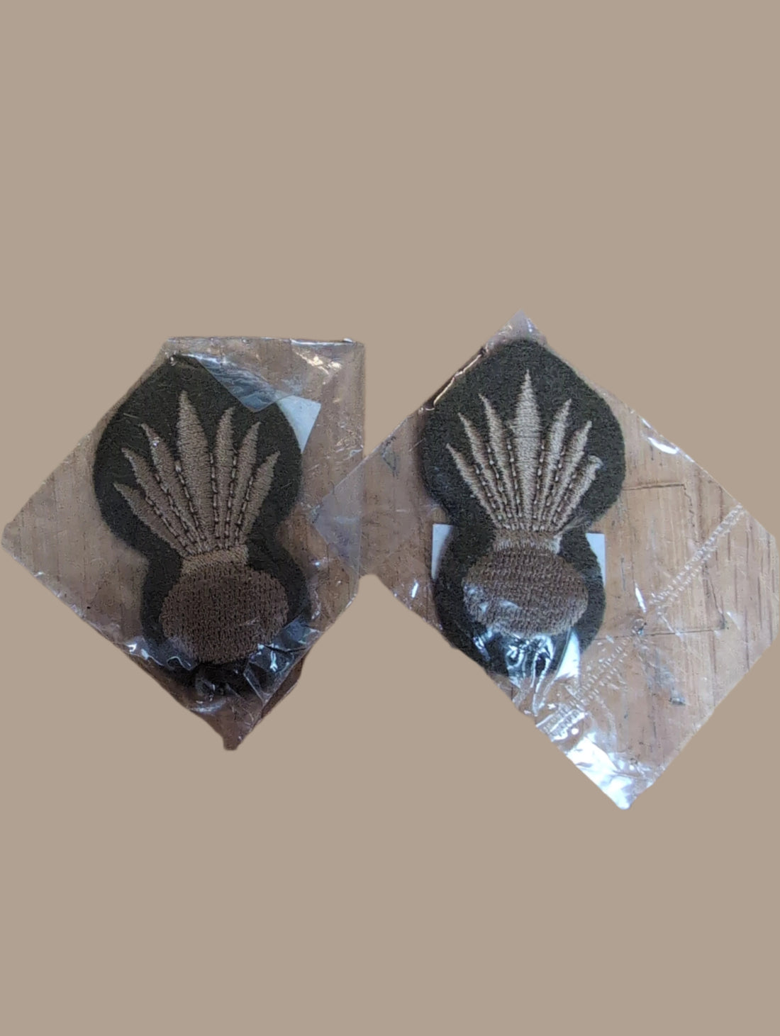 1 Pair of Grenadier Guards Pioneer Rank Badge Embroidered in light brown cotton thread on onto Khaki wool backing Suitable for current issue No.2 service dress uniform, Condition is new in original military packaging with NSN being 8455-99-974-2154