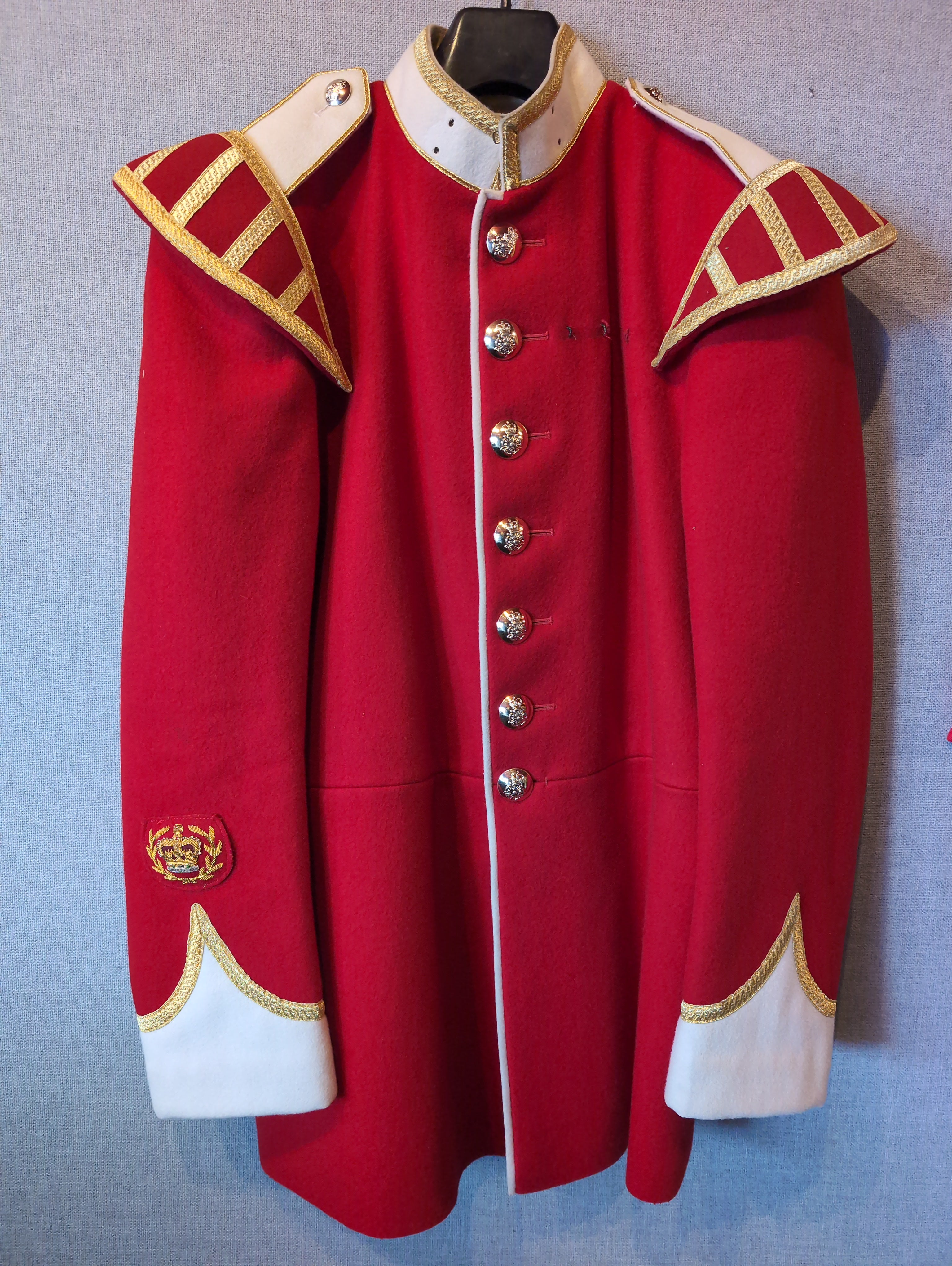 A King's Division bandsman's ceremonial tunic. Scarlet Melton wool with white facings and white piping, WO2 rank, bandsman's insignia. our ref G83