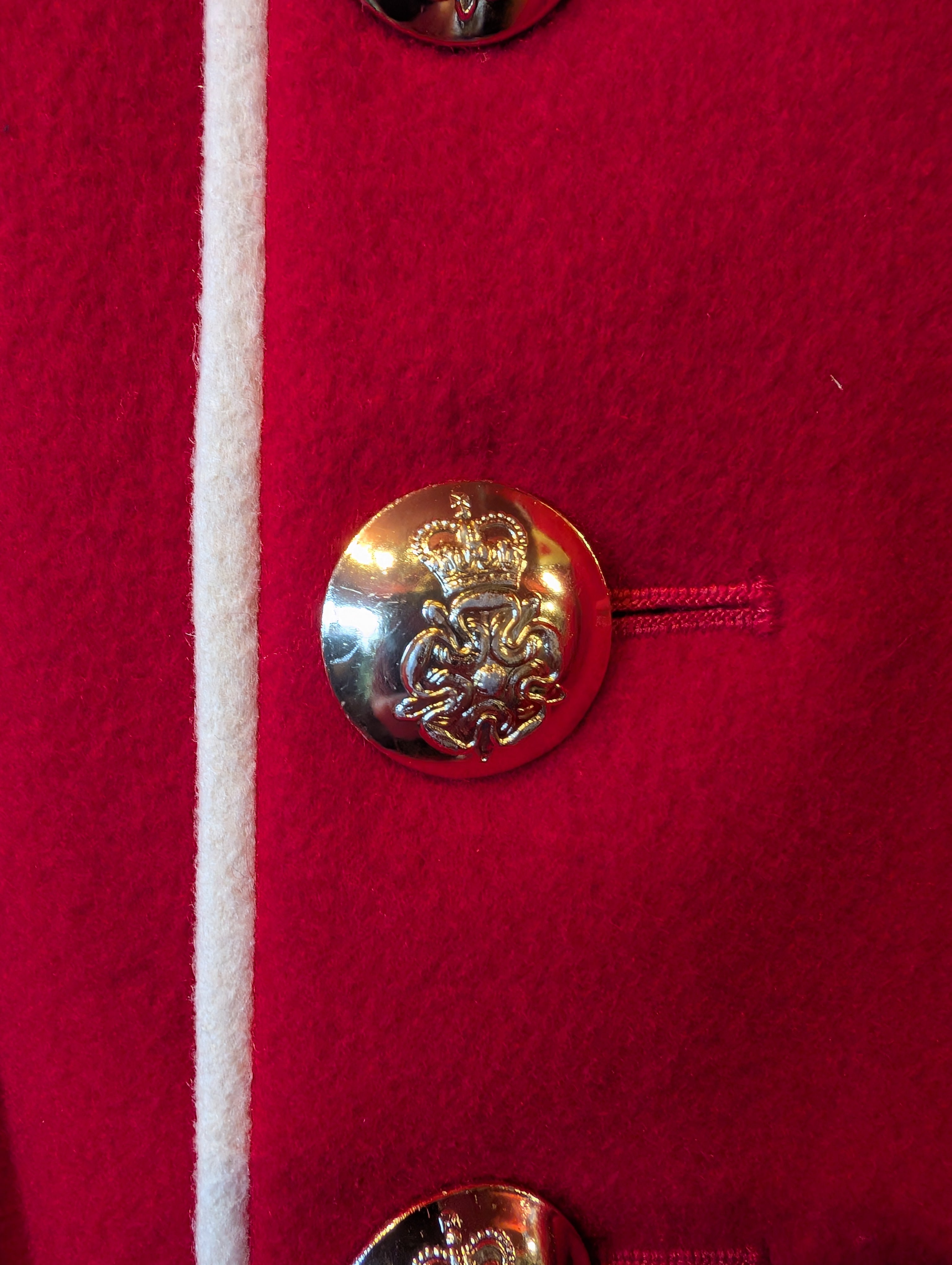 A King's Division bandsman's ceremonial tunic. Scarlet Melton wool with white facings and white piping, WO2 rank, bandsman's insignia. our ref G83