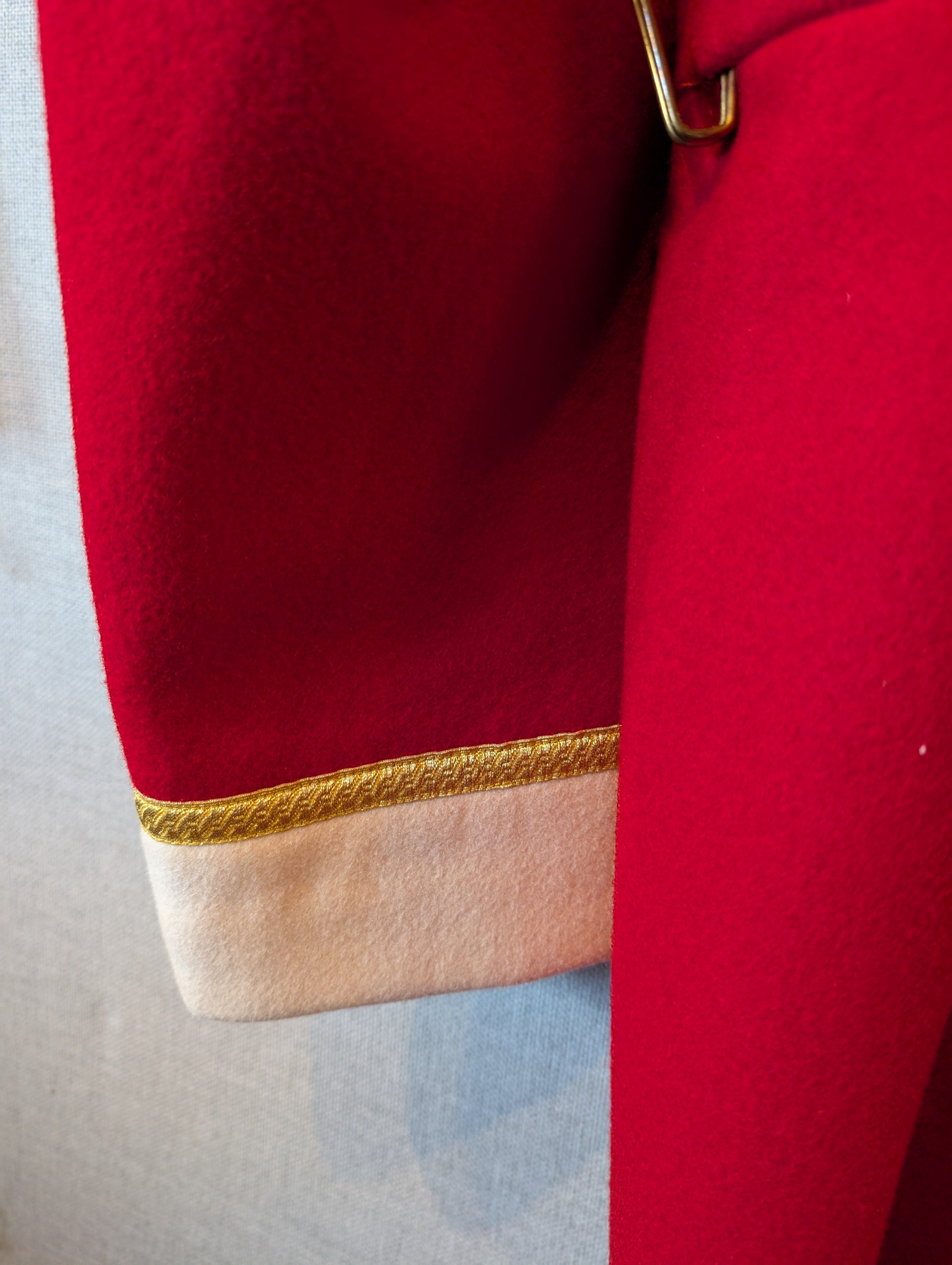 A King's Division bandsman's ceremonial tunic. Scarlet Melton wool with white facings and white piping, WO2 rank, bandsman's insignia. our ref G83